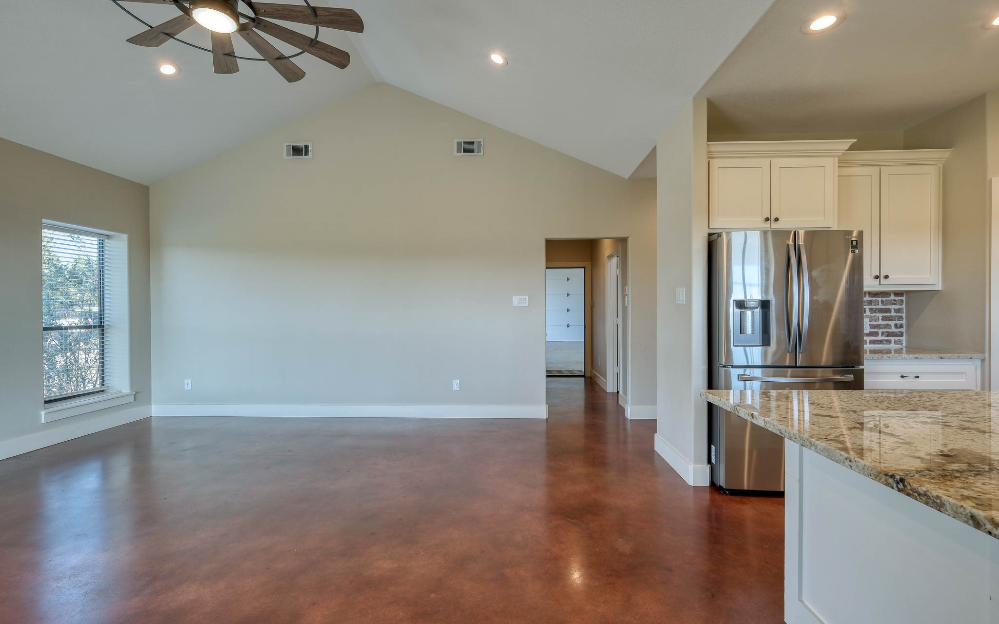 40934 Thomas Lane Hempstead, TX 77445 - Photo 11 of 50 a view of a kitchen with a sink refrigerator and wooden floor