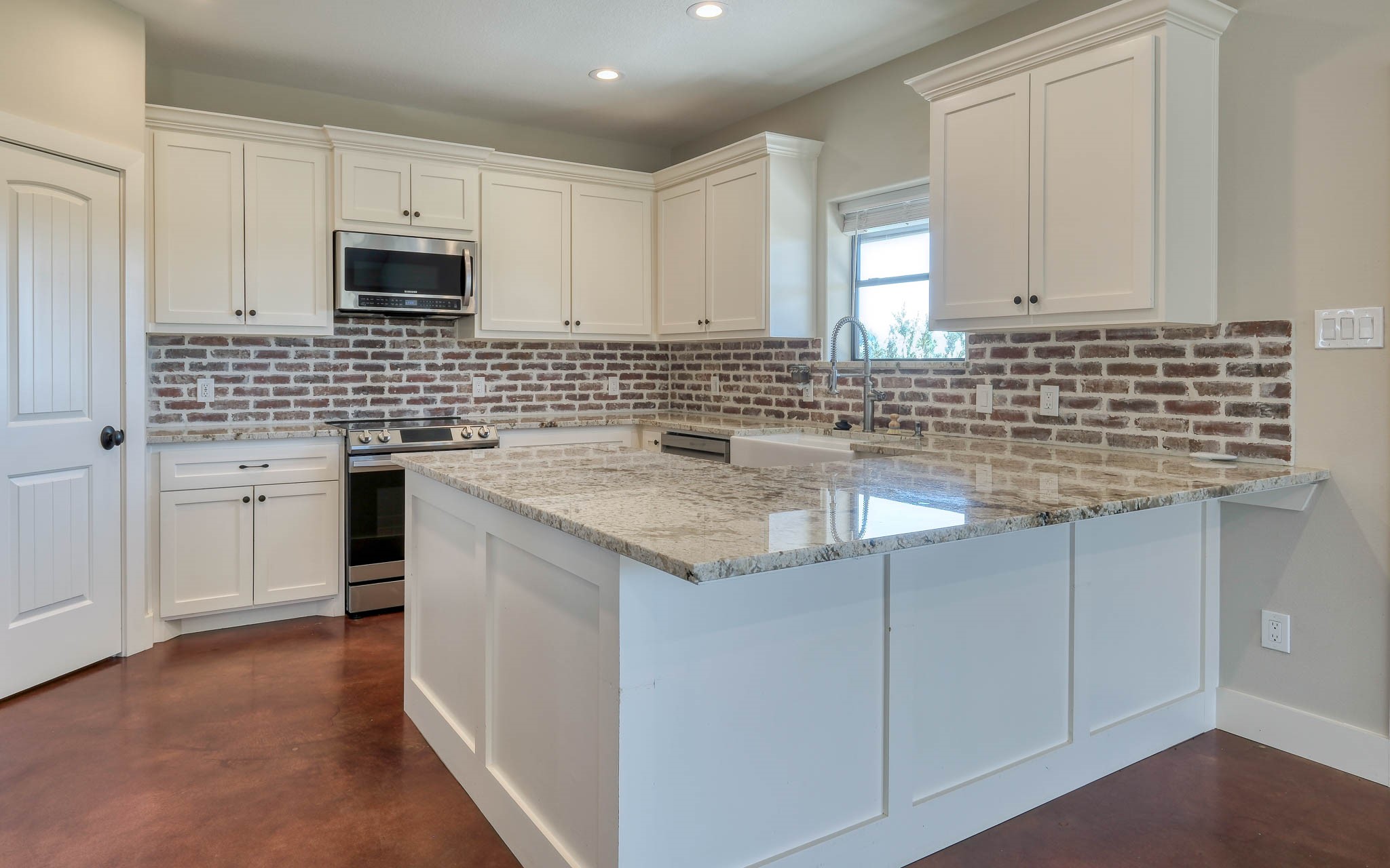 40934 Thomas Lane Hempstead, TX 77445 - Photo 14 of 50 a kitchen with stainless steel appliances granite countertop a sink stove and cabinets