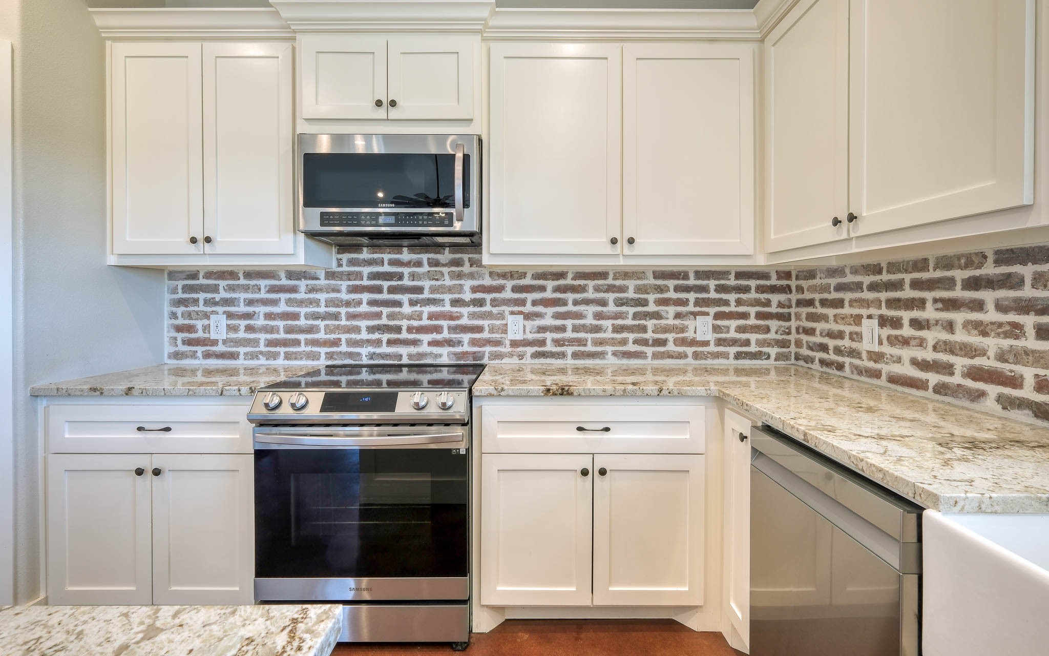 40934 Thomas Lane Hempstead, TX 77445 - Photo 15 of 50 a kitchen with granite countertop white cabinets and stainless steel appliances