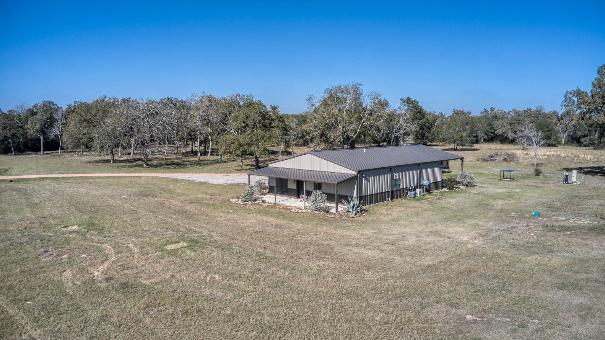 40934 Thomas Lane Hempstead, TX 77445 - Photo 46 of 50 a view of a house with a yard and sitting area