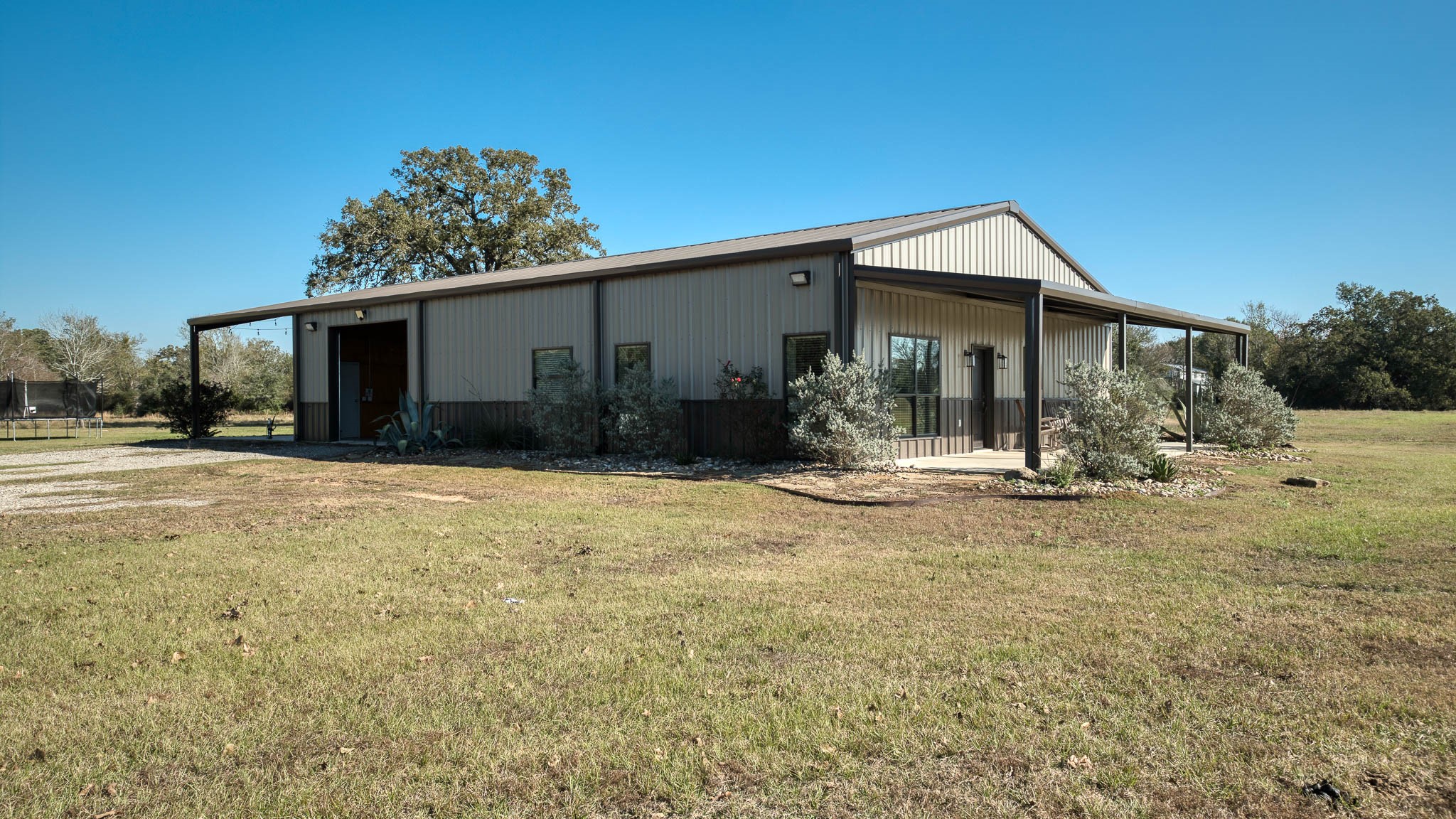40934 Thomas Lane Hempstead, TX 77445 - Photo 10 of 50 a view of a house with backyard and trees