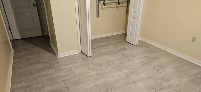 an empty room with a bench