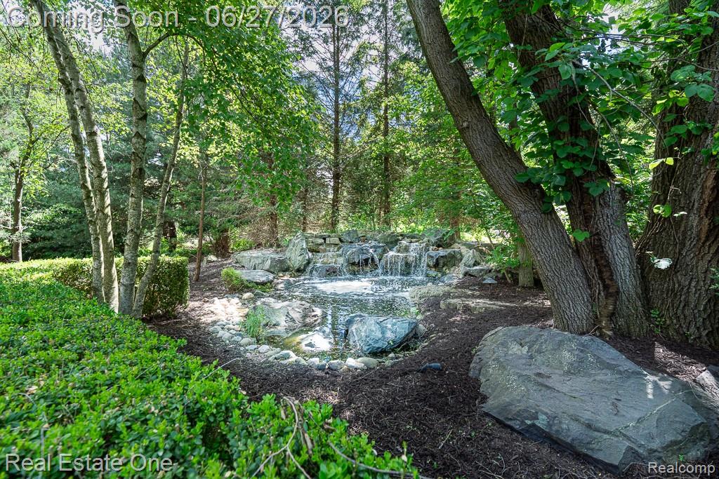 3347 St George Court Rochester, MI 48306 - Photo 42 of 51 Backyard waterfall
