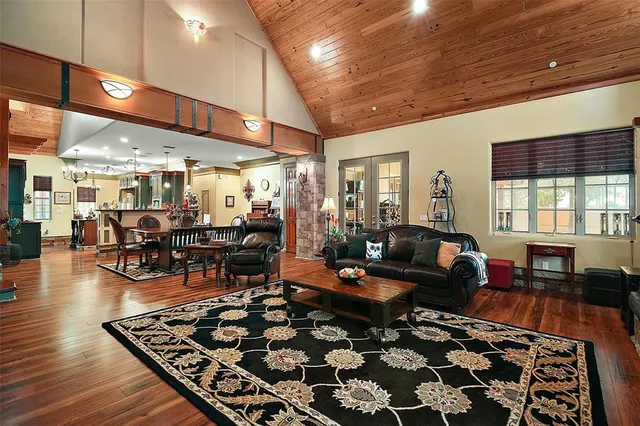 a living room with lots of furniture and a rug