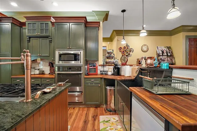 a kitchen with lots of counter top space and appliances