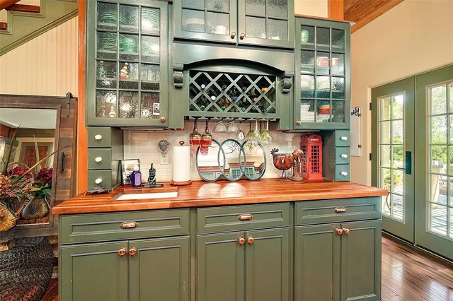 a kitchen with stainless steel appliances granite countertop a sink a stove and a refrigerator