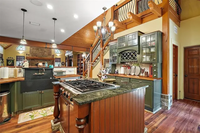 a dining room with furniture and a mirror