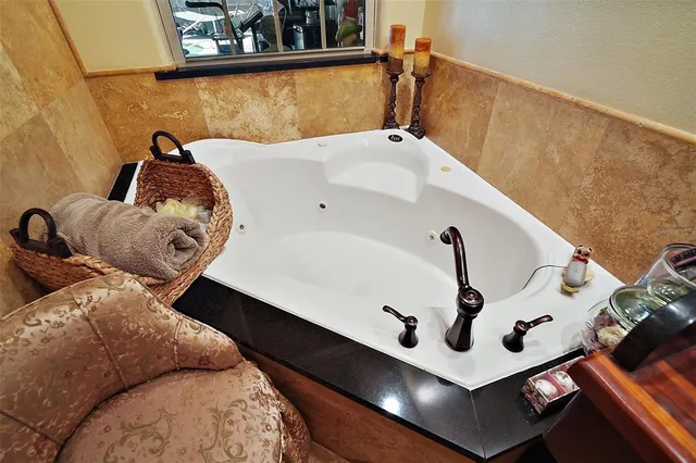 a view of a swimming pool with a patio and a yard