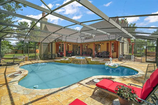 a view of swimming pool with outdoor seating