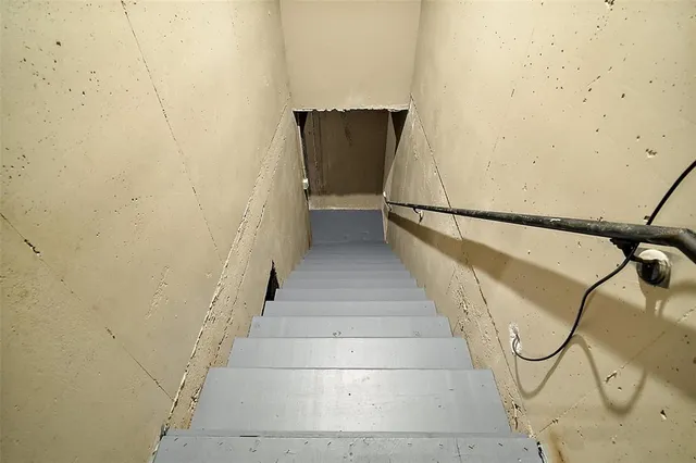 a view of a livingroom with furniture and an empty room