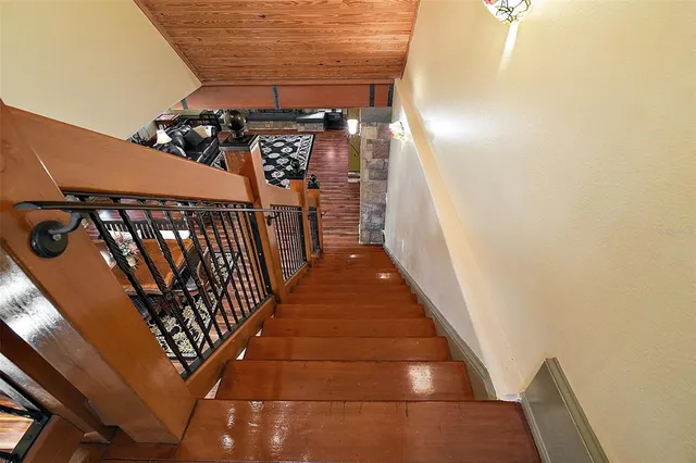 a view of a patio with table and chairs and potted plants