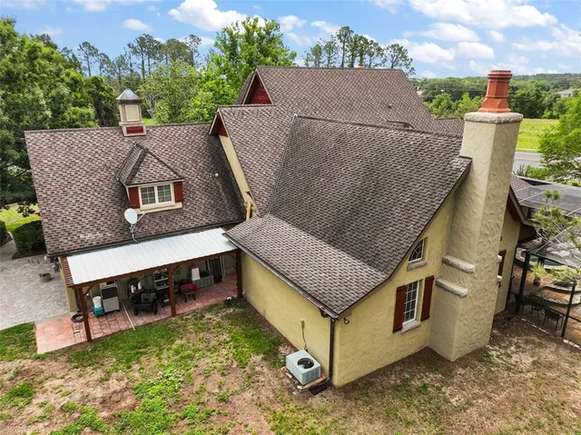an aerial view of a house with a garden