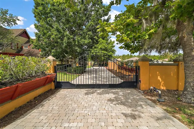 an aerial view of residential houses with outdoor space and river
