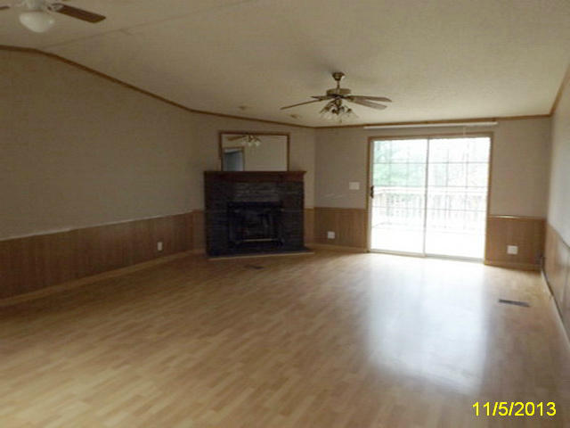 1270 Lick Ridge Road Northeast Check, VA 24072 - Photo 3 of 11 an empty room with windows and fireplace