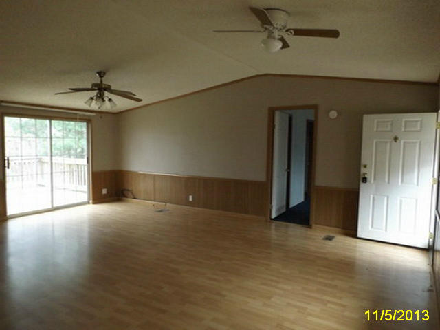 1270 Lick Ridge Road Northeast Check, VA 24072 - Photo 6 of 11 en empty room with windows and ceiling fan