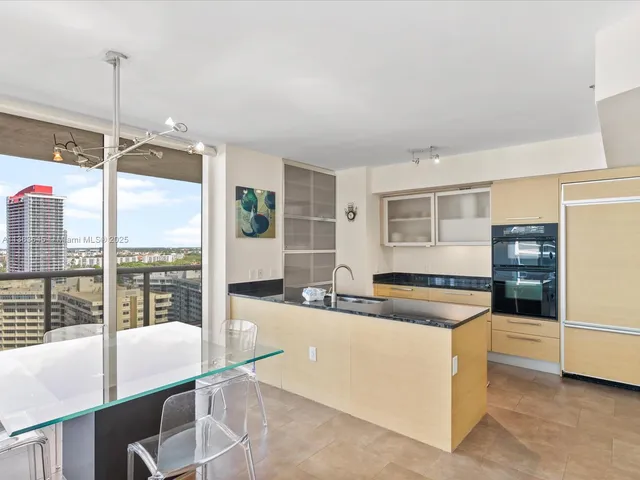 a kitchen with counter top space and appliances