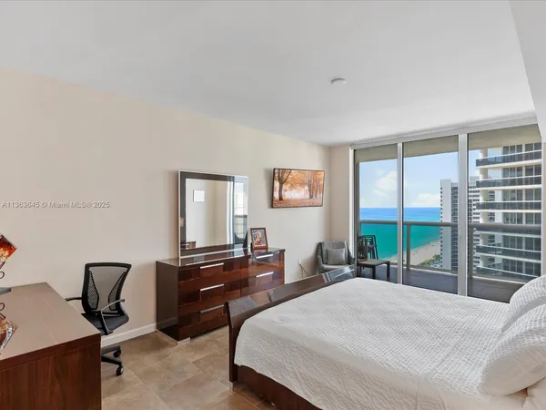 a bedroom with a bed and a desk