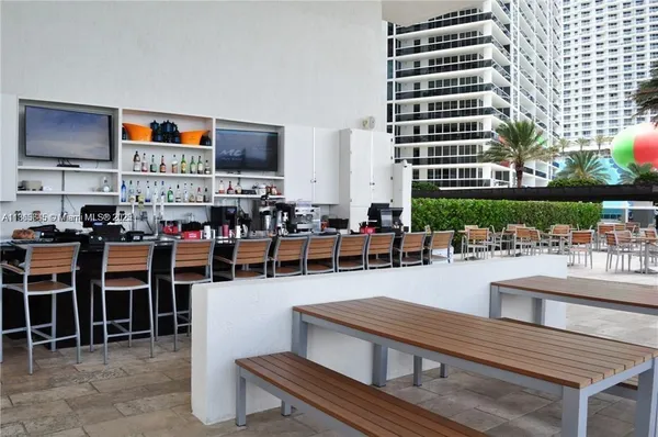 a outdoor space with lots of table and chairs