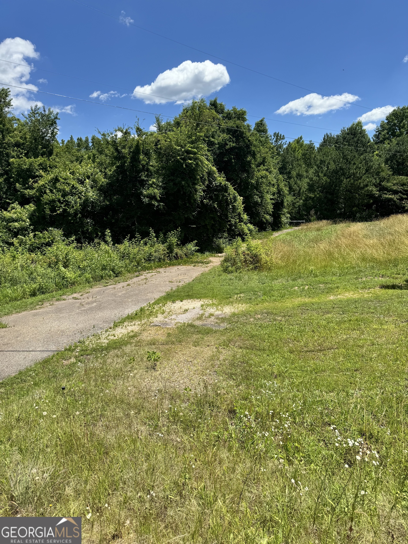 a view of a yard with an outdoor space and seating area