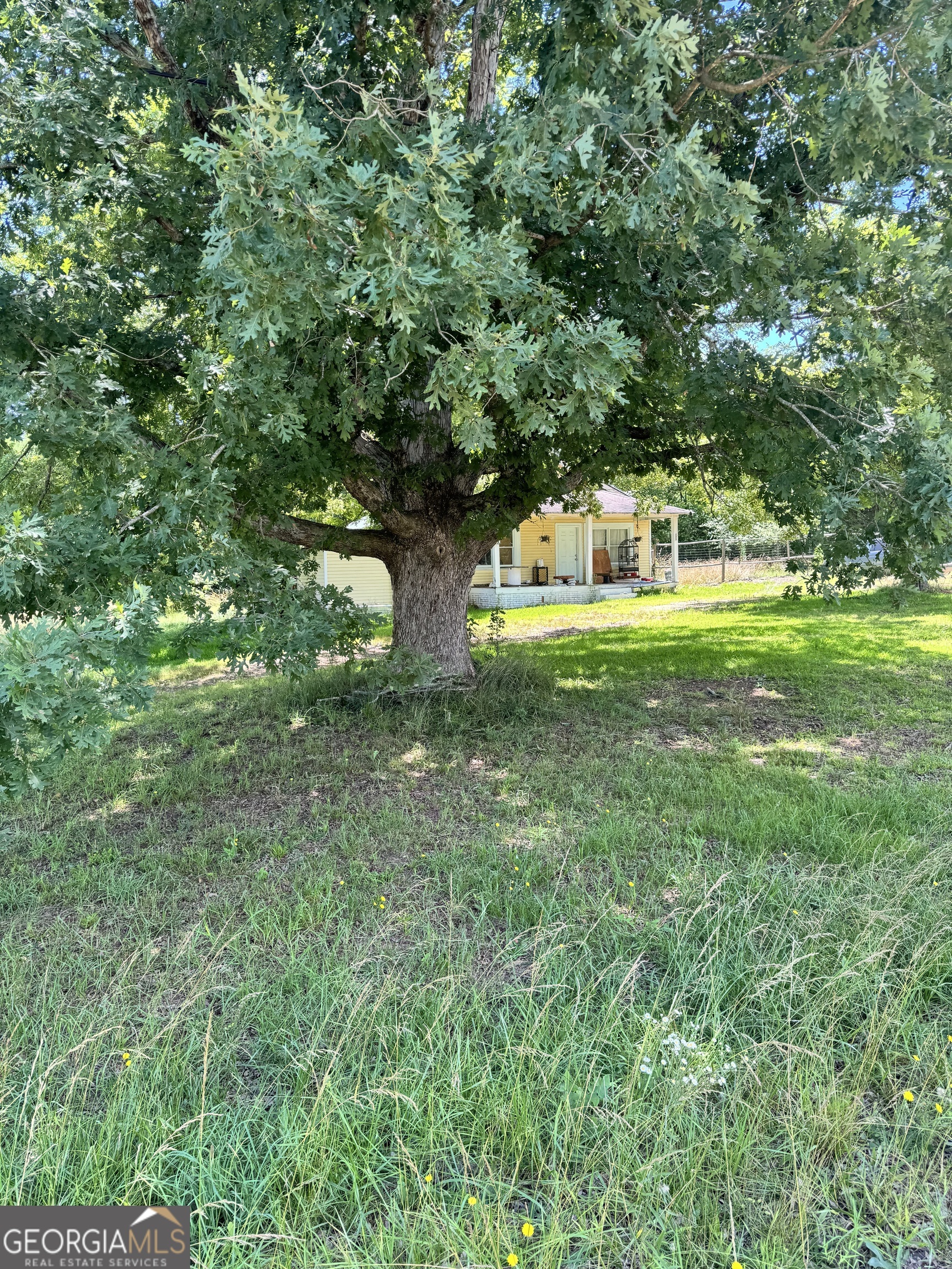 2883 Highway 441 Commerce, GA 30529 - Photo 5 of 12 a front view of a house with a yard