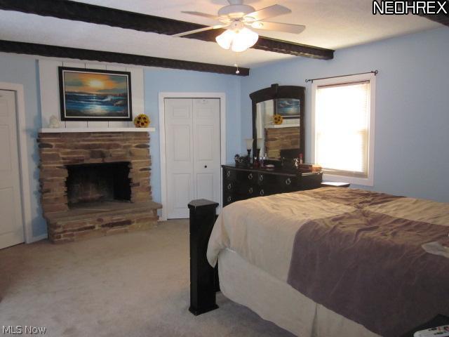 2411 Liberty Road Stow, OH 44224 - Photo 6 of 25 Extra large master bedroom retreat with stone fireplace. His and hers closets with plenty of room for your wardrobe.