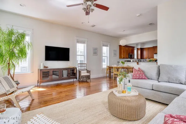 a living room with furniture and a large window