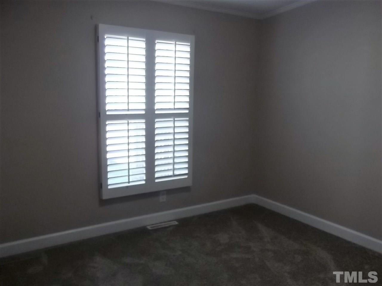 1060 Wrenn Crumpton Road Roxboro, NC 27574 - Photo 17 of 21 an empty room with a window