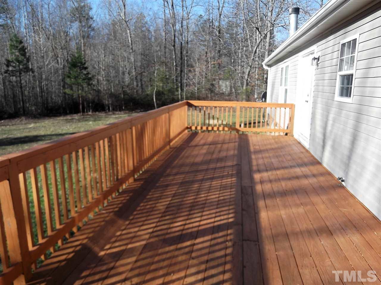 1060 Wrenn Crumpton Road Roxboro, NC 27574 - Photo 4 of 21 a view of balcony with wooden floor