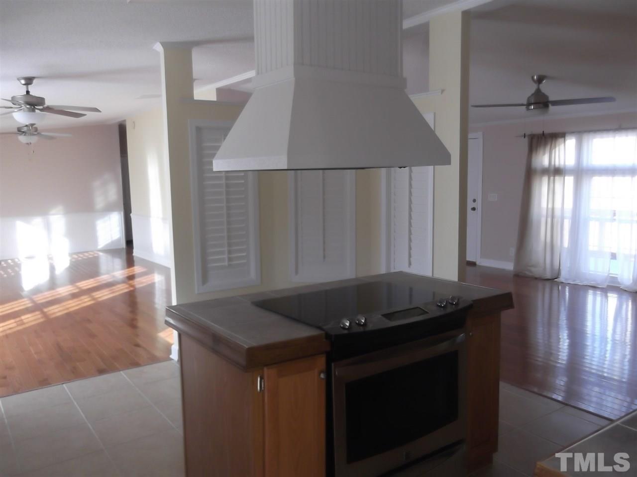 1060 Wrenn Crumpton Road Roxboro, NC 27574 - Photo 5 of 21 a kitchen with granite countertop a stove and a sink