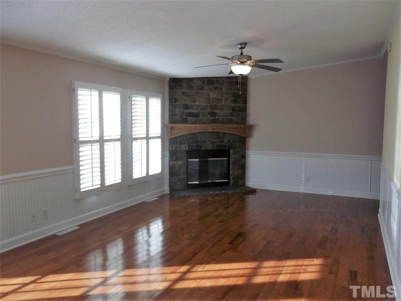 1060 Wrenn Crumpton Road Roxboro, NC 27574 - Photo 8 of 21 a view of a livingroom with a fireplace and window