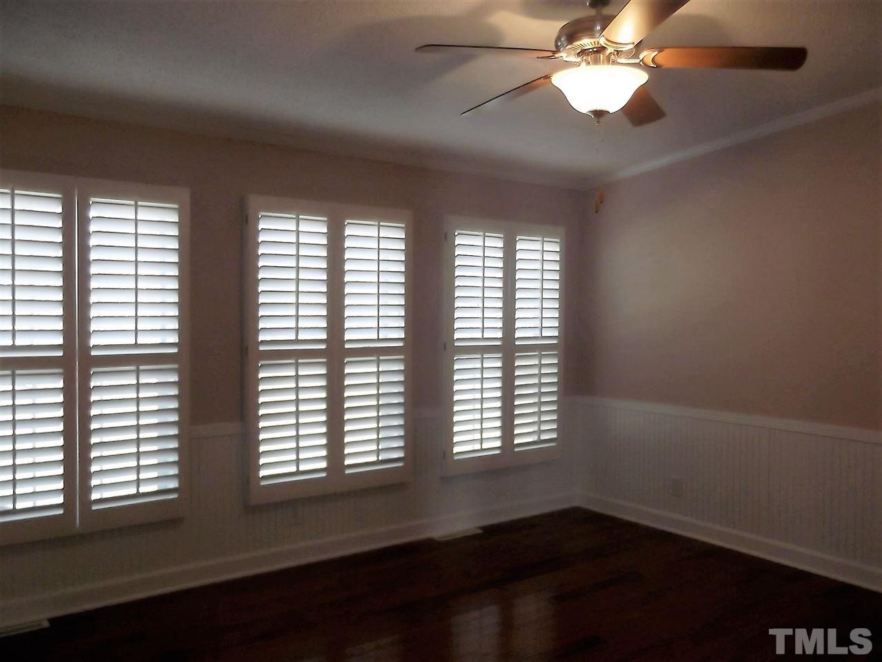 1060 Wrenn Crumpton Road Roxboro, NC 27574 - Photo 10 of 21 a view of an empty room with wooden floor and a window