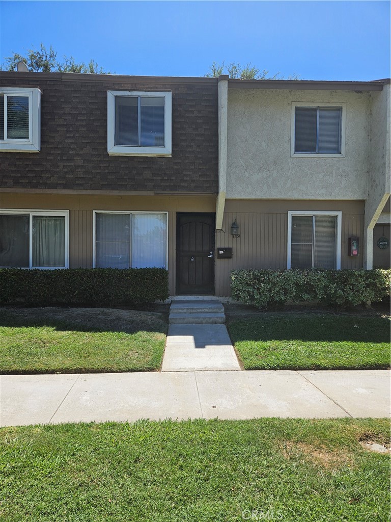 1151 Clark Street Riverside, CA 92501 - Photo 1 of 24 a front view of a house with yard