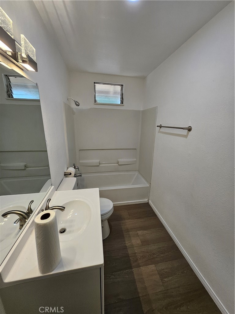 1151 Clark Street Riverside, CA 92501 - Photo 15 of 24 a bathroom with a sink and a tub