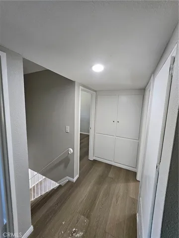 a view of a livingroom with wooden floor