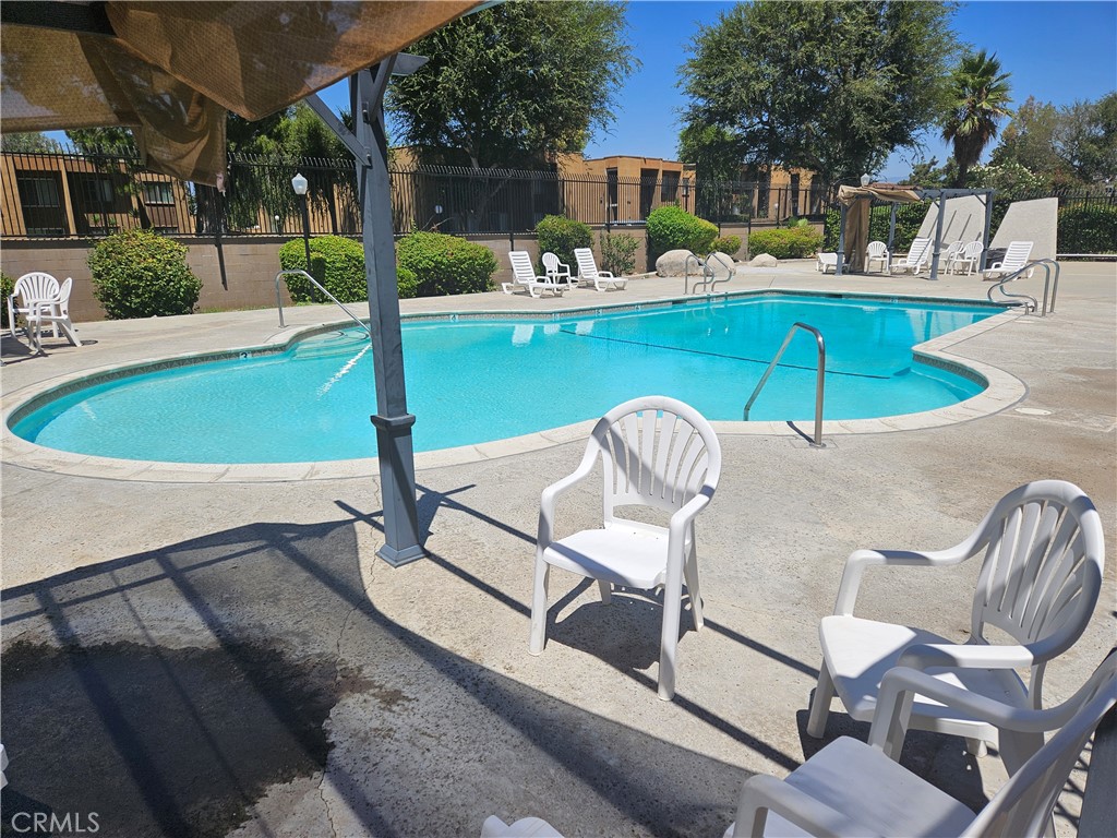 1151 Clark Street Riverside, CA 92501 - Photo 19 of 21 a view of a patio with swimming pool table and chairs