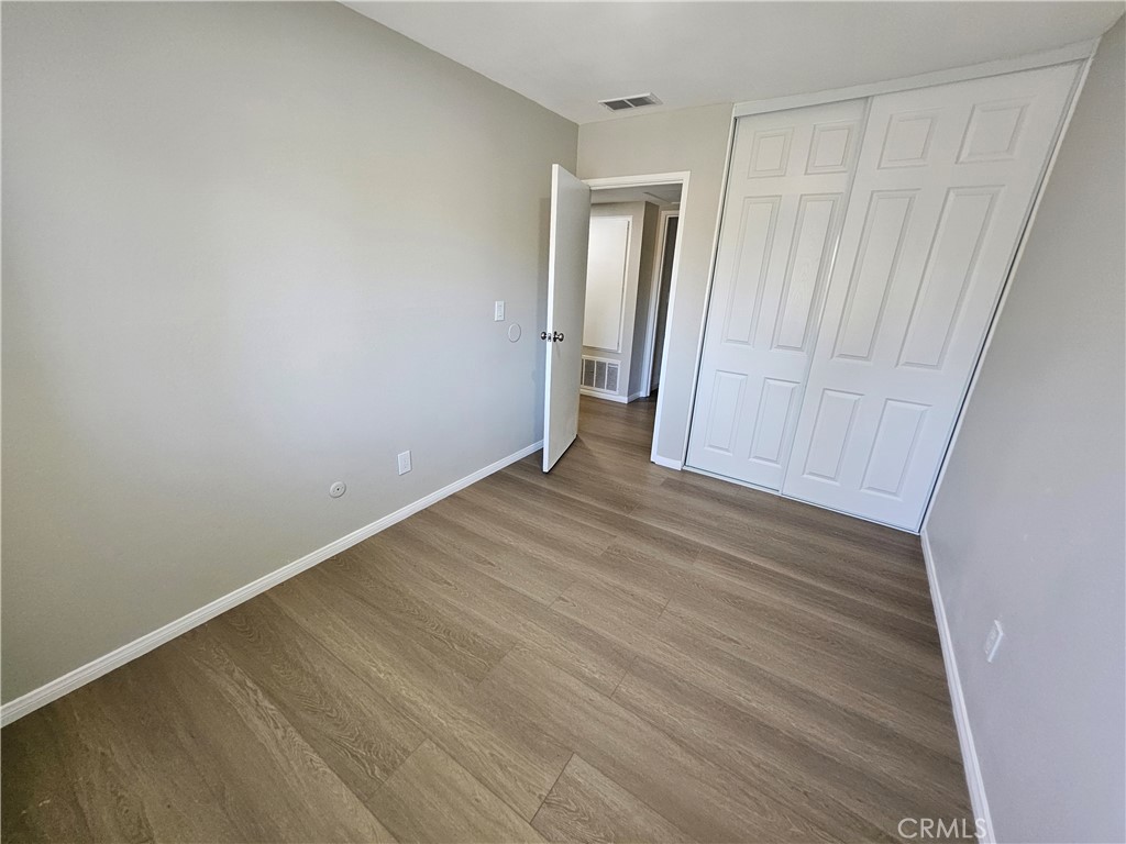 1151 Clark Street Riverside, CA 92501 - Photo 19 of 24 a view of an empty room with wooden floor