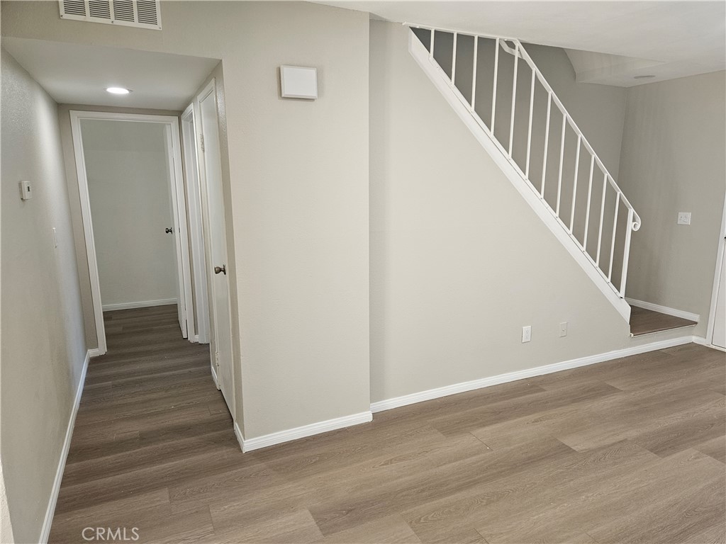 1151 Clark Street Riverside, CA 92501 - Photo 5 of 24 a view of a hallway with wooden floor and entryway