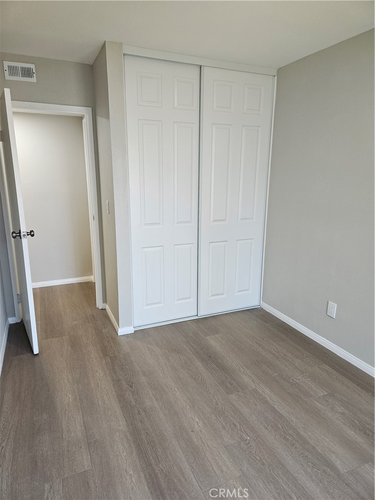 1151 Clark Street Riverside, CA 92501 - Photo 7 of 24 a view of an empty room with wooden floor