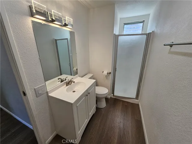 a bathroom with a sink a mirror and a toilet