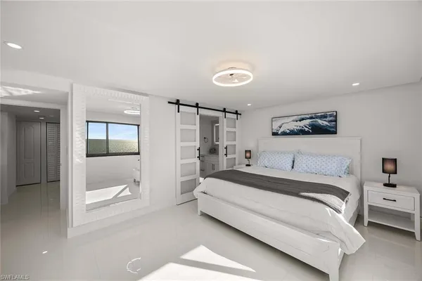 a spacious bedroom with a bed and a glass door shower
