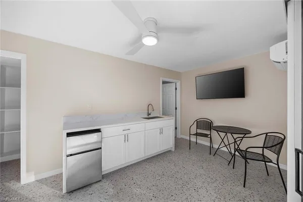 a bedroom with furniture and a window