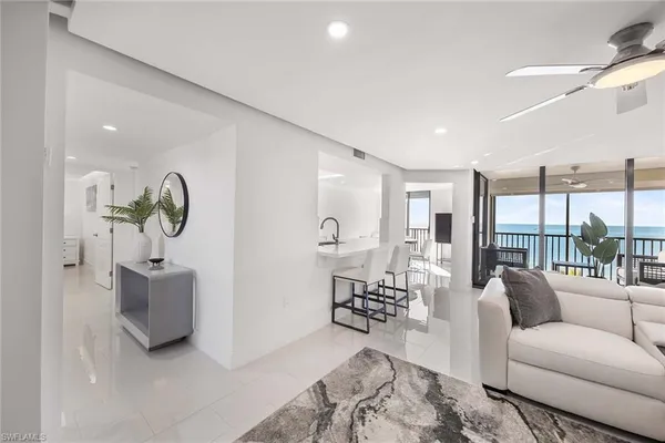 a living room with furniture and windows