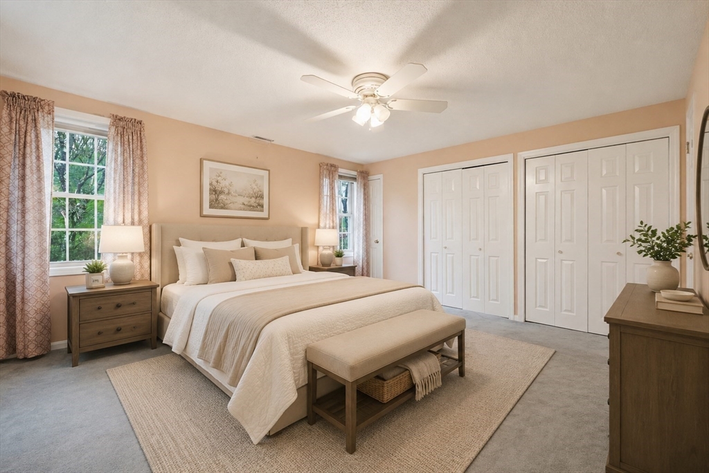 3301 Maple Brook Road, Unit 301 Bellingham, MA 02019 - Photo 20 of 29 a spacious bedroom with a bed and a chandelier