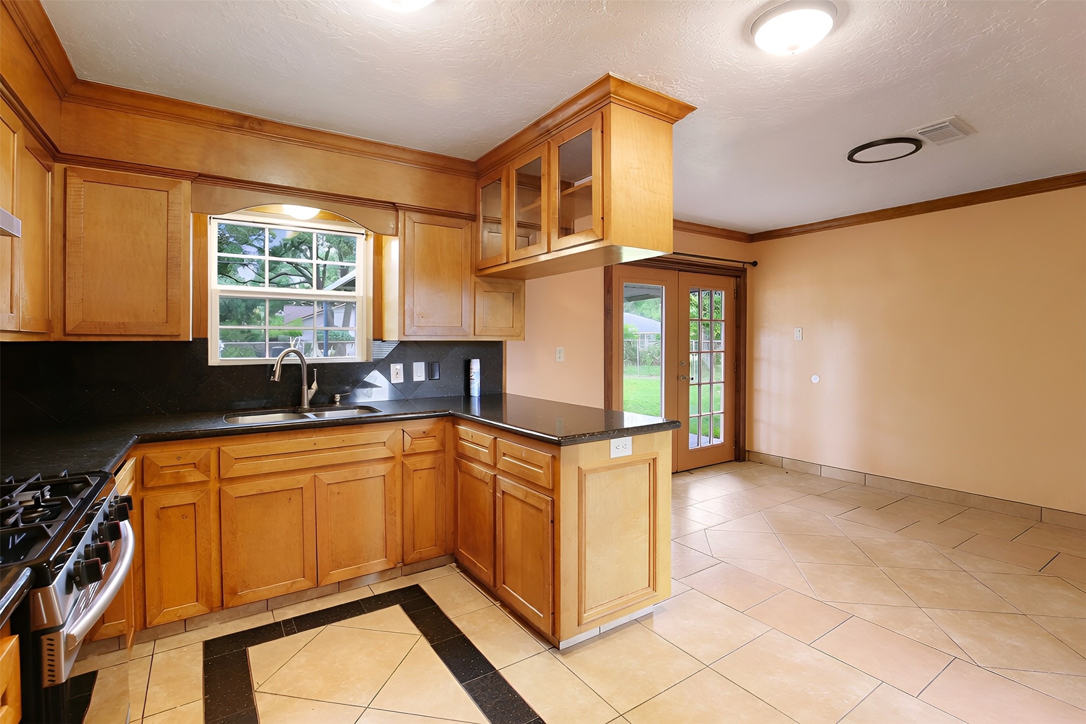 6923 Leader Street Houston, TX 77074 - Photo 11 of 19 a kitchen that has a sink and a stove