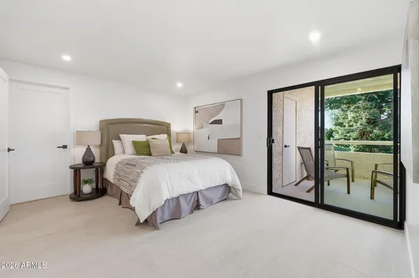 a room with gym equipment and large windows