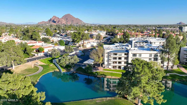 a view of a chairs and table in a patio