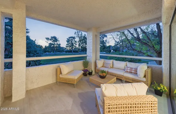 a kitchen with a dining table chairs and a dining table with wooden floor