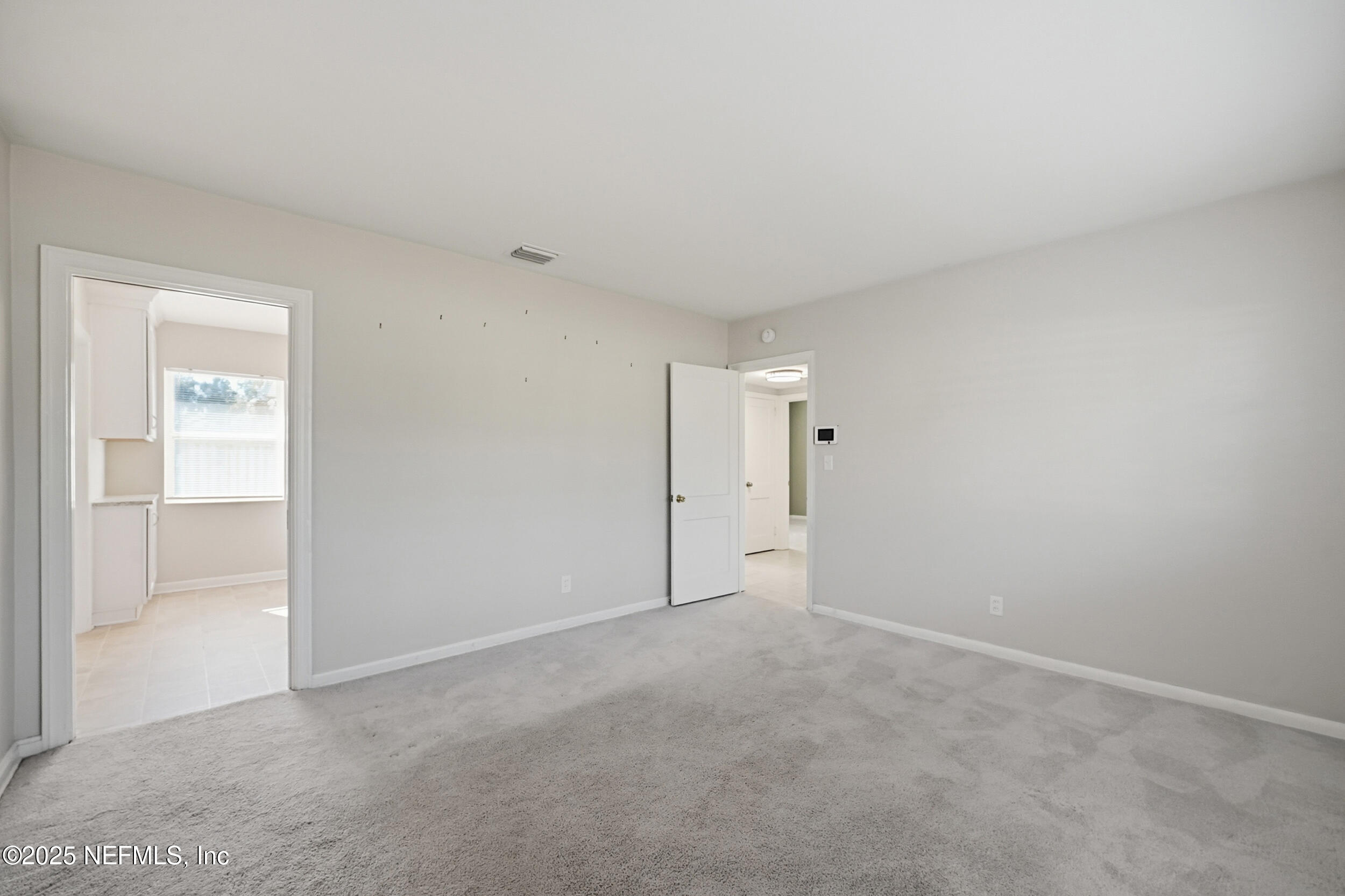 6500 Altama Road Jacksonville, FL 32216 - Photo 11 of 30 an empty room with an entryway