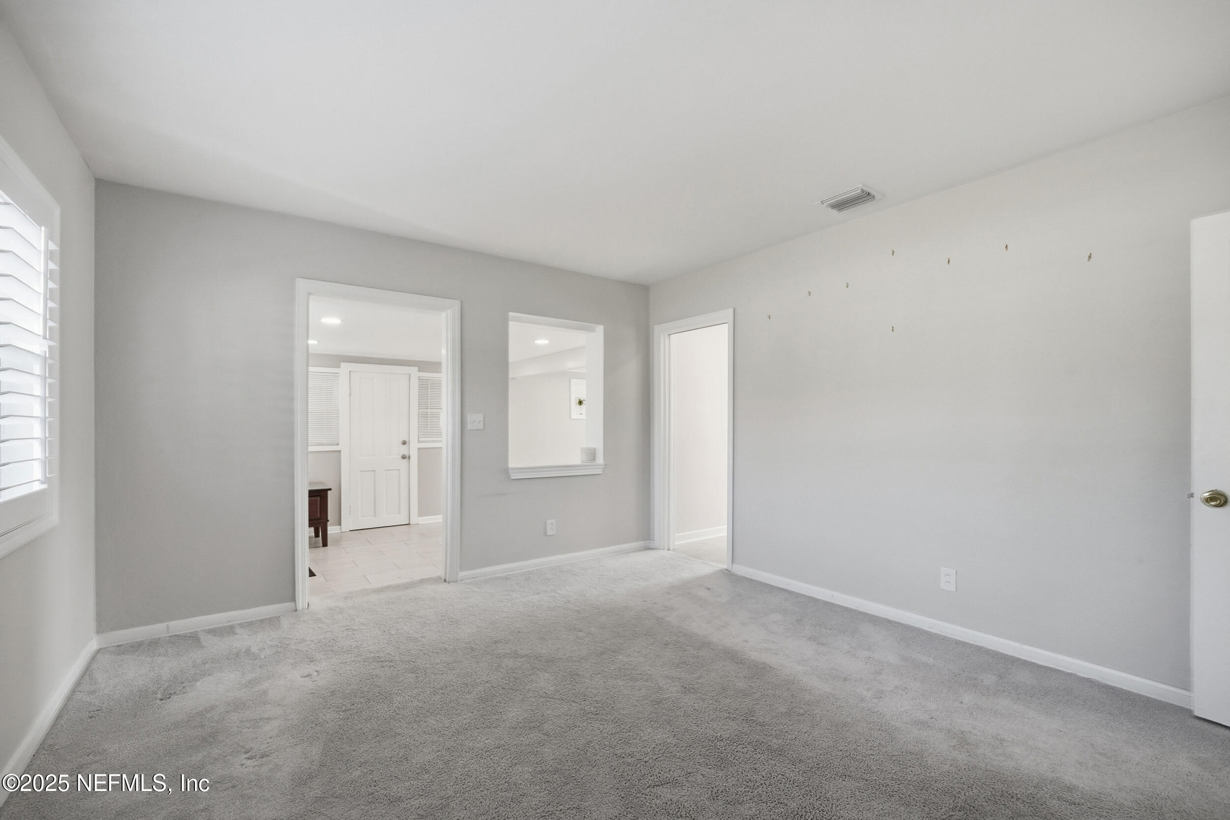 6500 Altama Road Jacksonville, FL 32216 - Photo 13 of 30 a view of an empty room and window