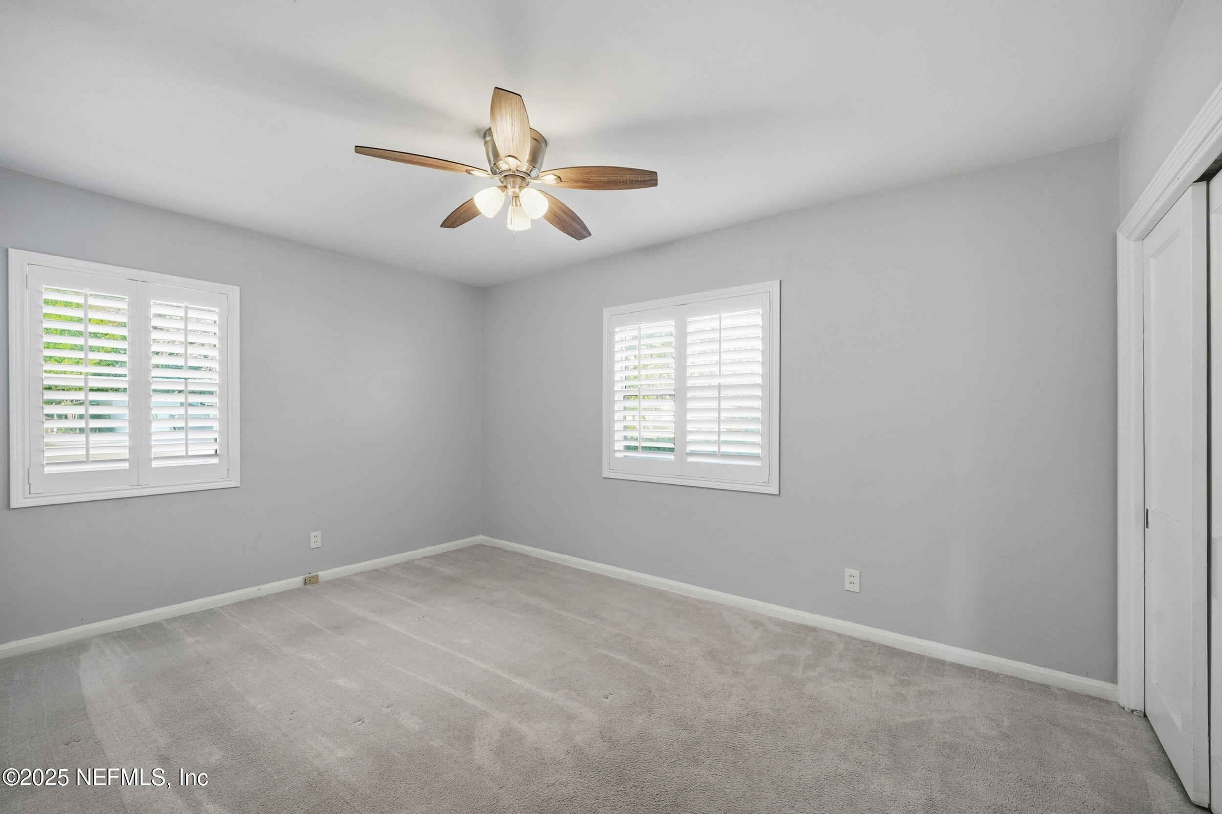 6500 Altama Road Jacksonville, FL 32216 - Photo 14 of 30 an empty room with windows and fan
